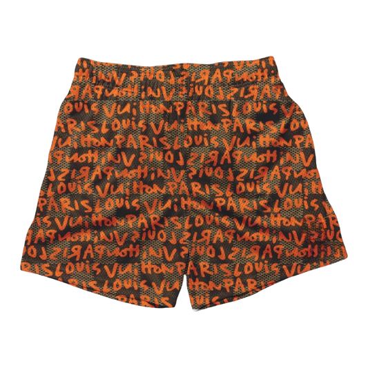 an orange and black shorts with words written on it