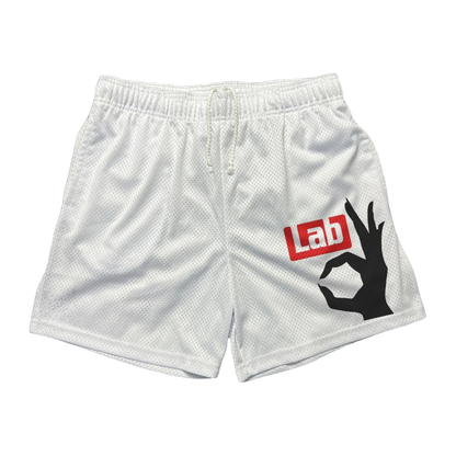 a white lacrosse shorts with the word lab on it