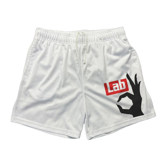 a white lacrosse shorts with the word lab on it