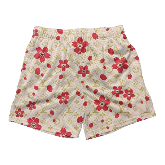 a white shorts with red flowers on it