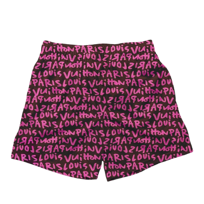 a pink and black shorts with the words paris written on it