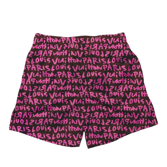 a pink and black shorts with the words paris written on it