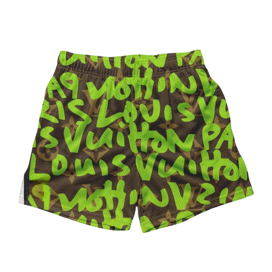 a green and black shorts with letters on it